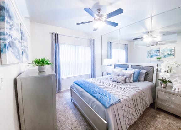 Scenic bedroom windows at Tuscany Square Apartments in North Dallas, TX. Now leasing studios, 1 and 2 bedroom apartments.