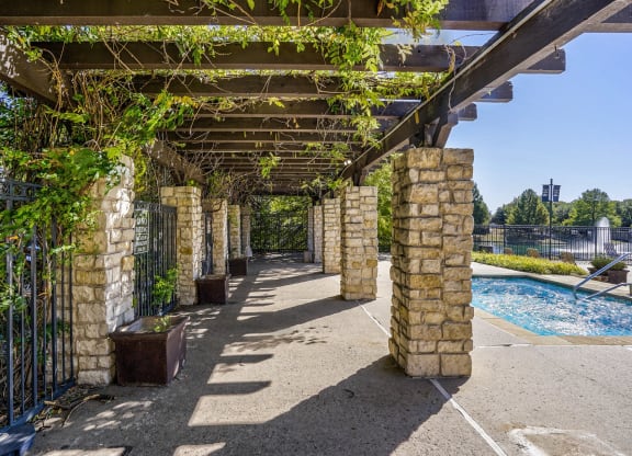 A shady pergola overlooking the pool at Cypress Lake at Stonebriar in Frisco, TX!