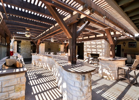 Grilling area outside of the community pool area at Cypress Lake at Stonebriar in Frisco, TX!