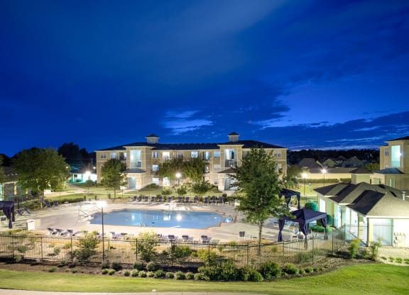 Sparkling pool at night at Sonoma Grande Apartments in South Tulsa, OK 1, 2 & 3 Bedrooms.