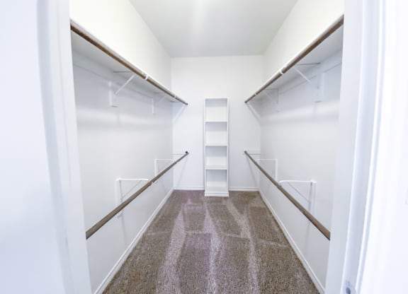 Oversized walk in closet at Tuscany Square Apartments in North Dallas, TX. Now leasing studios, 1 and 2 bedroom apartments.