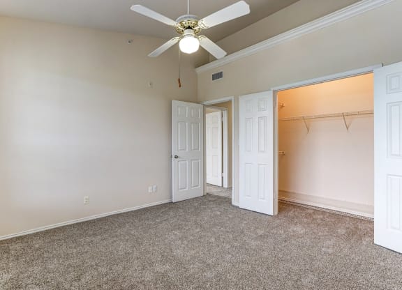 Large bedrooms with spacious closet space at Turnberry Isle Apartments in Dallas, TX.