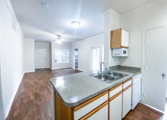 Built in microwave, dishwasher and private backyard at Tuscany Square Apartments in North Dallas, TX. Now leasing studios, 1 and 2 bedroom apartments.