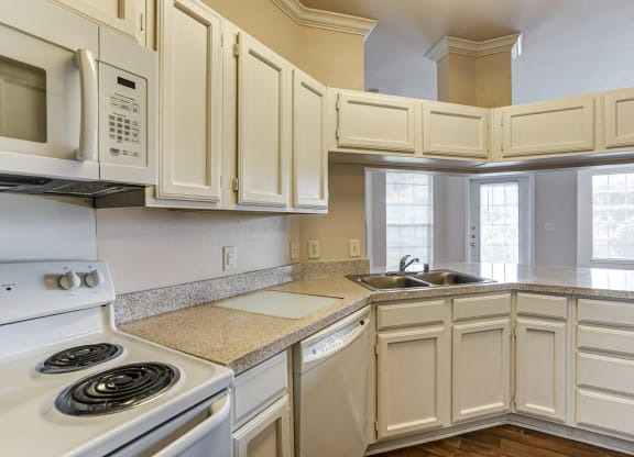 Large kitchens with ample storage space at Turnberry Isle Apartments in Dallas, TX.