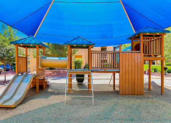 a playground at a park with a slide