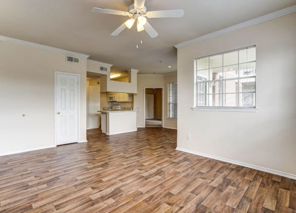 Bright and spacious living rooms at Turnberry Isle Apartments in Dallas, TX.