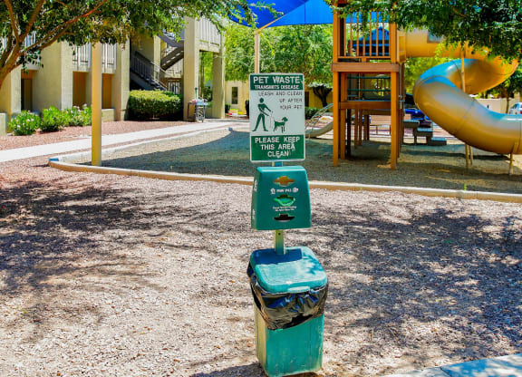 a street sign in the middle of a park