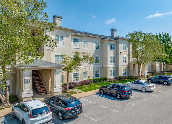 A large building with a parking lot in front of it.