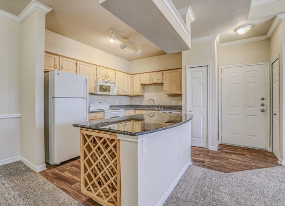 Bright and spacious kitchen with built in wine racks at Cypress Lake at Stonebriar in Frisco, TX!
