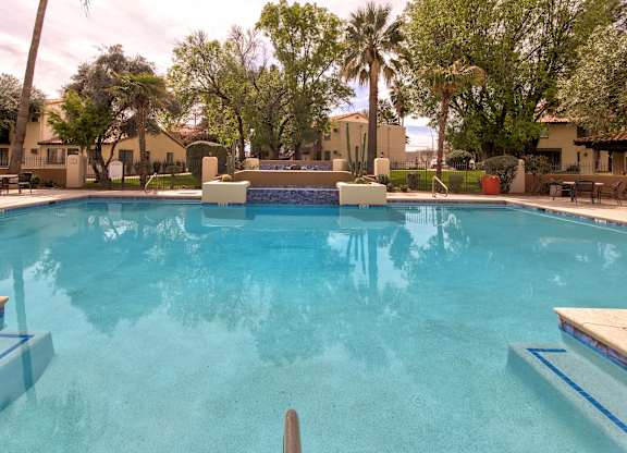 A swimming pool with a blue tinted water.