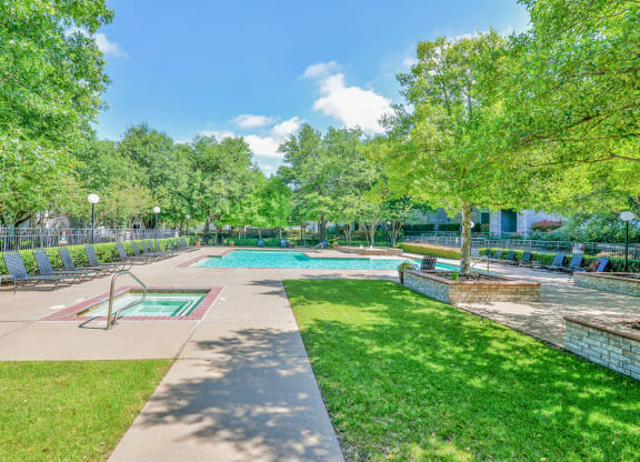 a park with a swimming pool and trees