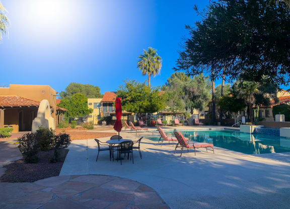 Sparkling pool and lounge area at La Hacienda Apartments in Tucson, AZ!