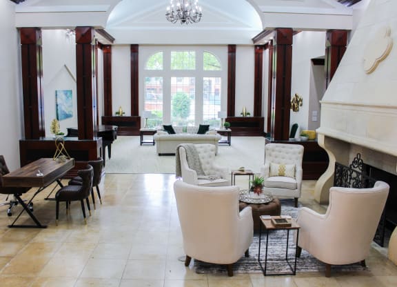 Community Clubhouse lounge area with a fireplace. Montfort Place in North Dallas, TX, For Rent. Now leasing 1 and 2 bedroom apartments.