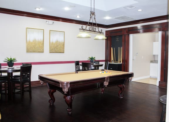 Montfort Place clubhouse billiard's table. Montfort Place in North Dallas, TX, For Rent. Now leasing 1 and 2 bedroom apartments.
