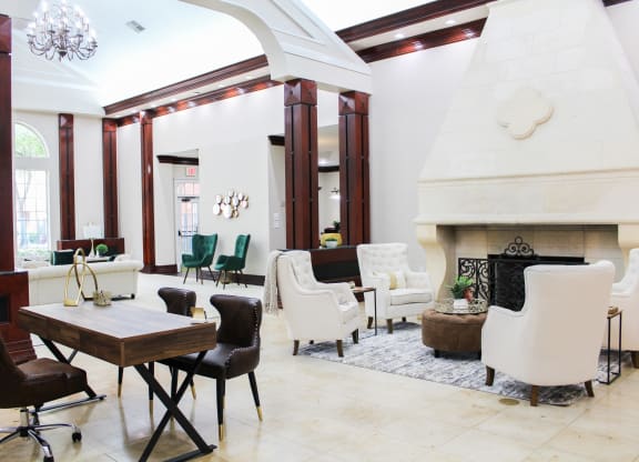 Leasing Office at Montfort Place Apartments. Two large couches and two emerald green chairs. Montfort Place in North Dallas, TX, For Rent. Now leasing 1 and 2 bedroom apartments.