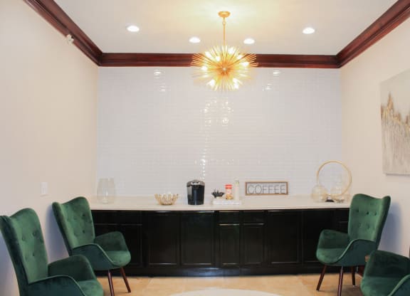 Coffee bar at Montfort Place in the clubhouse.  Two lounge chairs to sit and enjoy a cup of coffee.