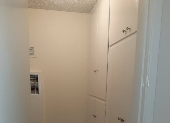A white door with a handle is on the right side of the image.