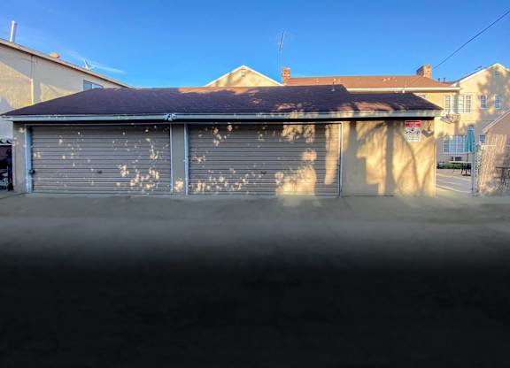 A garage door with a lot of holes in it.
