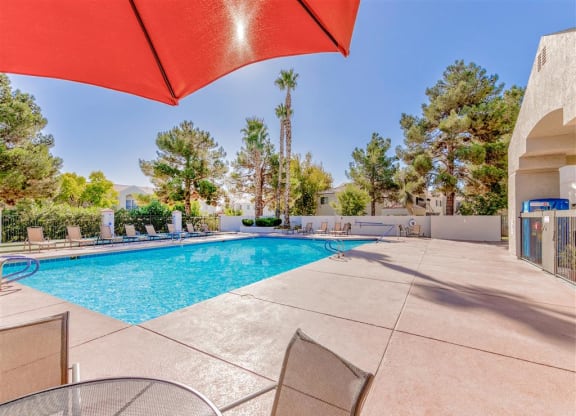 Resort pool umbrella at Country Club at Valley View Senior Apartments in Las Vegas, NV, For Rent. Now leasing 1 and 2 bedroom apartments.