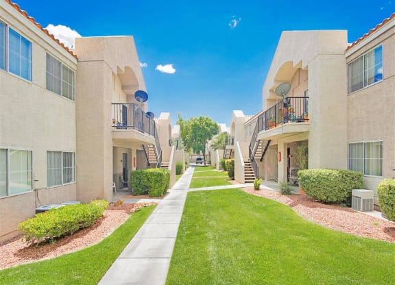 Lush walkways of Country Club at Valley View Senior Apartments in Las Vegas, NV, For Rent. Now leasing 1 and 2 bedroom apartments.