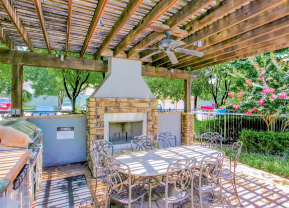 Outdoor fireplace and BBQ Grills at The Remington at Memorial in Tulsa, OK, For Rent. Now leasing 1 and 2 bedroom apartments.