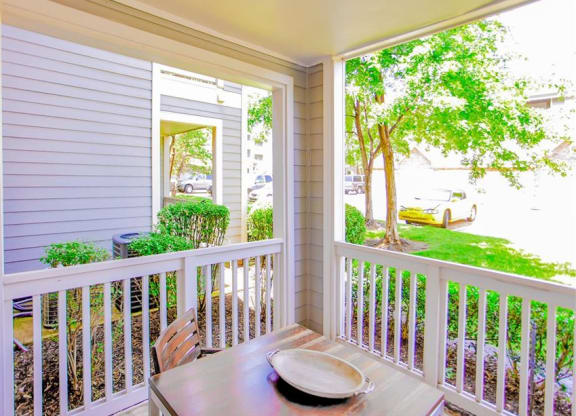 Outdoor dining in private patio at The Remington at Memorial in Tulsa, OK, For Rent. Now leasing 1 and 2 bedroom apartments.