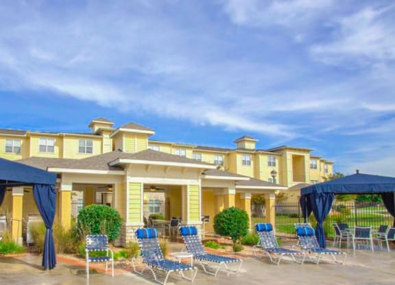 Lounge chairs and cabanas on sun deck Sonoma Grande Apartment Homes