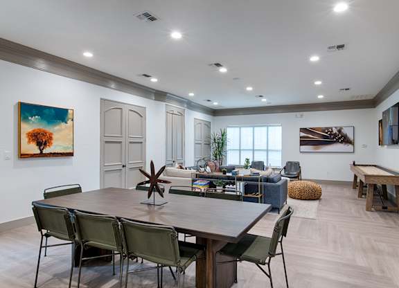 Community clubhouse with dining and lounge area at Silverado Apartments, Frisco