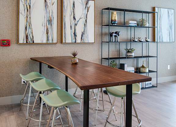 Community workspace with high top table and shelving at Silverado Apartments, Frisco, Texas