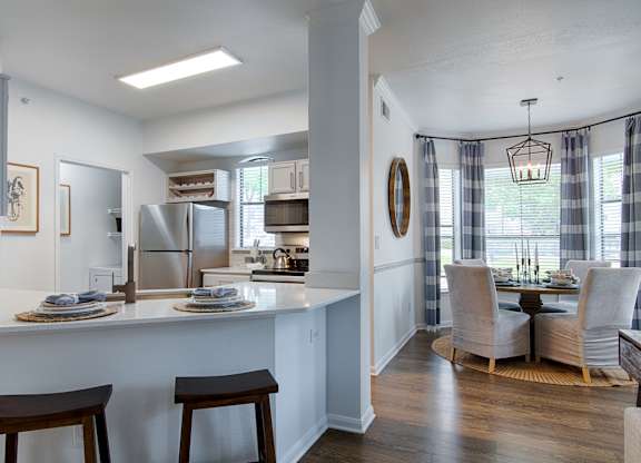 Open concept kitchen with breakfast bar and dining room at Silverado Apartments, Texas