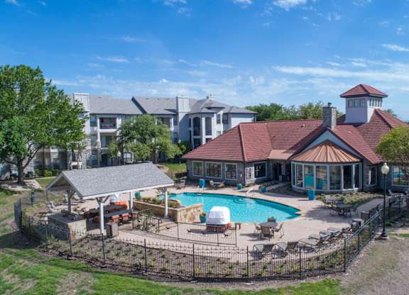 Resort style pool with clubhouse and covered pavilion at Silverado Apartments, Frisco, Texas