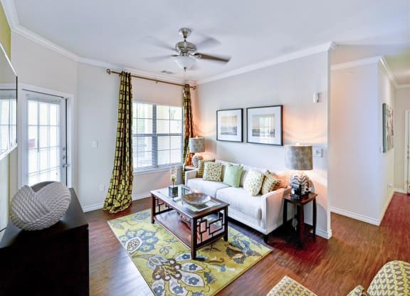 Spacious living rooms with bright windows at Mission at La Villita Apartments in Irving, TX offers 1, 2 & 3 bedroom apartment homes with appliances.