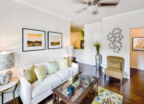 Spacious living rooms with ceiling fans at Mission at La Villita Apartments in Irving, TX offers 1, 2 & 3 bedroom apartment homes with appliances.