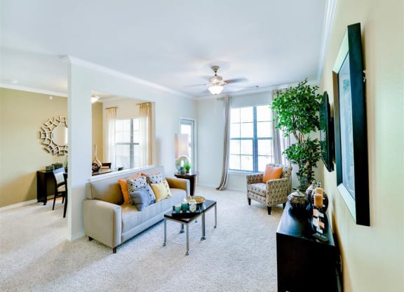 Spacious living rooms with bright windows at Mission at La Villita Apartments in Irving, TX offers 1, 2 & 3 bedroom apartment homes with appliances.