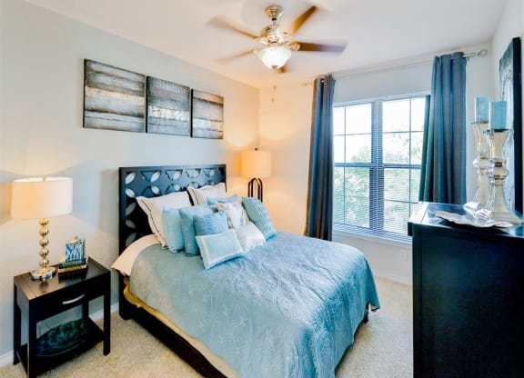 Large bedrooms with bright windows at Mission at La Villita Apartments in Irving, TX offers 1, 2 & 3 bedroom apartment homes with appliances.