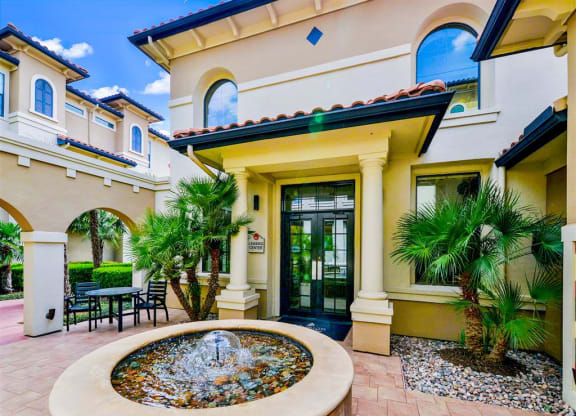 Zen fountain at entrance of leasing office of Mission at La Villita Apartments in Irving, TX offers 1, 2 & 3 bedroom apartment homes with appliances.