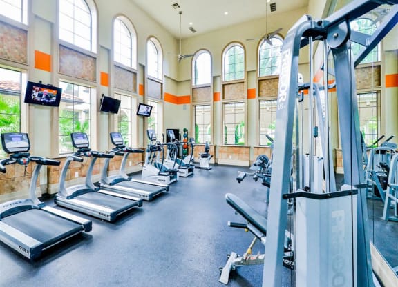 High energy fitness center fully equipped with fitness equipment in the Mission at La Villita Apartments in Irving, TX