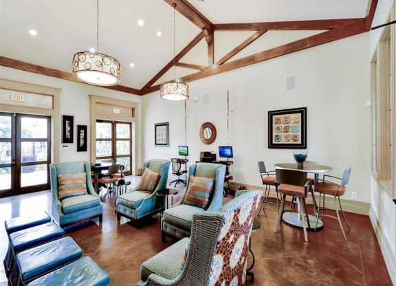 Clubhouse with lounging area at Mission at La Villita Apartments in Irving, TX offers 1, 2 & 3 bedroom apartment homes with appliances.