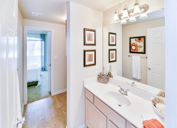 Mirrored vanity bathroom at Bentley Place at Willow Bend Apartments in West Plano, TX, For Rent. Now leasing 1, 2, and 3 bedroom apartments.