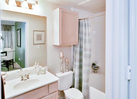 Bathroom storage at  Bentley Place at Willow Bend Apartments in West Plano, TX, For Rent. Now leasing 1, 2, and 3 bedroom apartments.