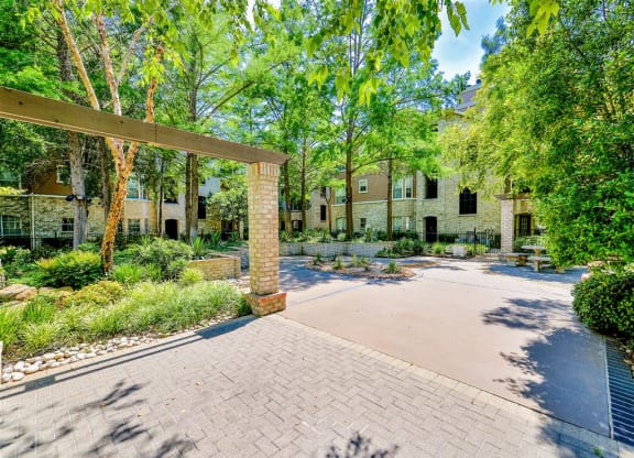 Lush grounds at Bentley Place at Willow Bend Apartments in West Plano, TX, For Rent. Now leasing 1, 2, and 3 bedroom apartments.