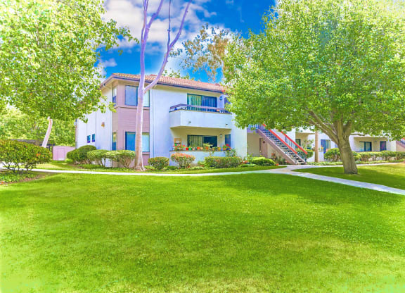 Balcony, patio with views of lush landscaping at Village Park Apartments in Encinitas, CA, For Rent. Now leasing 2 and 3 bedroom apartments.