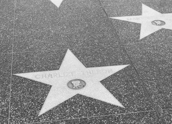 a black and white photo of the hollywood walk of fame