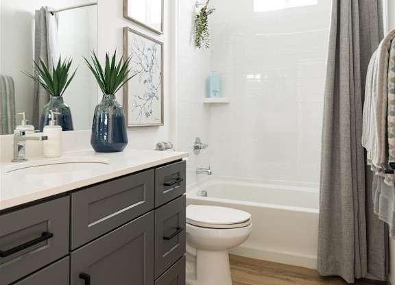 a bathroom with a sink and a toilet and a shower at Villas on Ash, Gilbert, 85234