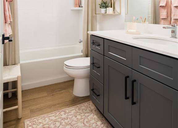 a bathroom with a shower and a sink and a toilet at Villas on Ash, Arizona