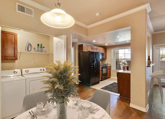 A kitchen with a table set for two and a pineapple centerpiece. at Superstition Canyon Apartments, Arizona, 85209