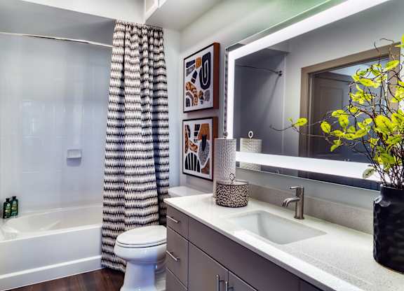 a bathroom with a shower and a sink and a toilet at Elevation at the Village, Gilbert