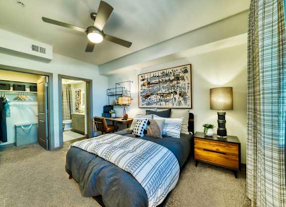 a bedroom with a bed and a ceiling fan at Elevation at the Village, Arizona, 85295