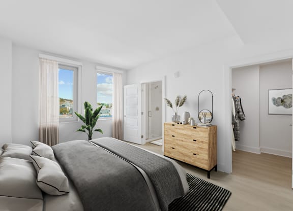 a bedroom with a bed and a dresser  at Link Apartments® H Street, Washington, 20002