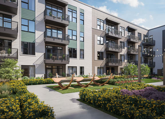 an apartment building with a sculpture of a boat in front of it at Link Apartments® Broad Ave, Memphis